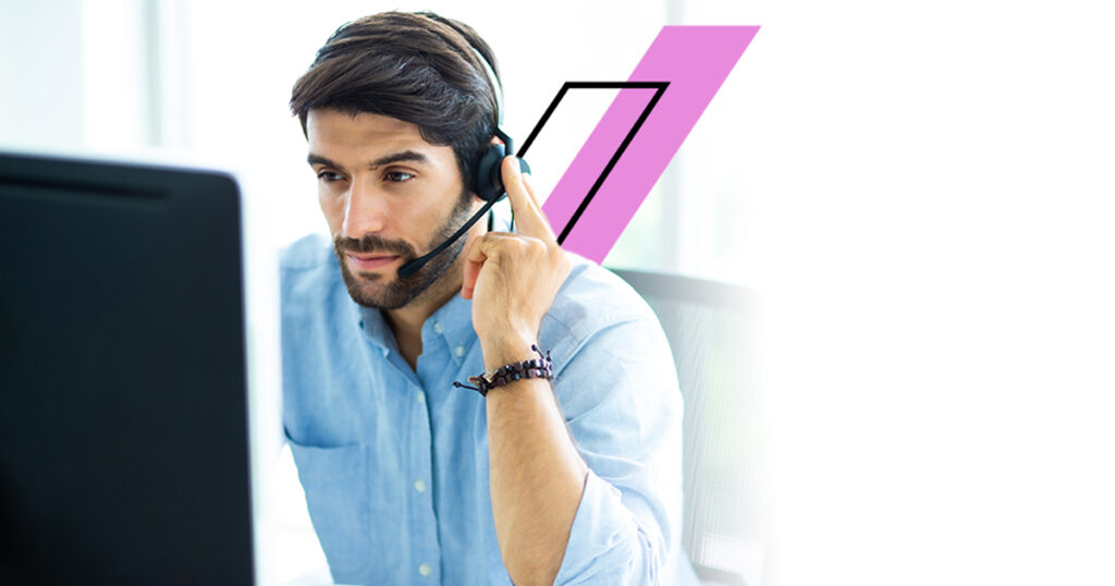 Portrait of handsome male customer service in headphones. Call center staff speaking with head set in modern office